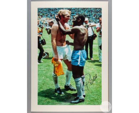 A large colour photographic print of Pele&nbsp;exchanging shirts with Bobby Moore following Brazil's defeat of England in the