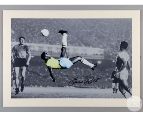 A large black and white/colour photographic print of Pele,
signed on the front by Pele in black pen,&nbsp;mounted, measuring 