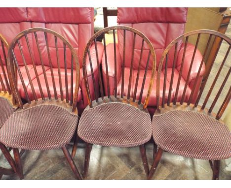Set of four stick back windsor dining chairs with upholstered seats 