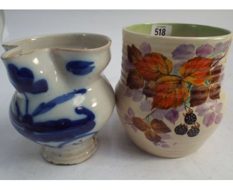 Clarice Cliff ribbed vase painted with blackberries and a delft jug.  Clarice Cliff pot 16cm tall 