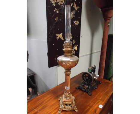 A Victorian gilt and rouge marble oil lamp