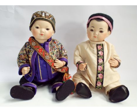 Two modern Chinese bisque head dressed dolls, 32cm tall 