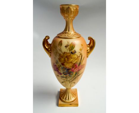 Royal Worcester blush ivory twin handled urn shaped vase, hand painted with spring flowers with gilt highlighting.  Numbered 