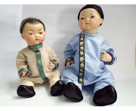 Two Chinese style modern bisque head jointed dressed dolls, the largest of which measures 46cm 