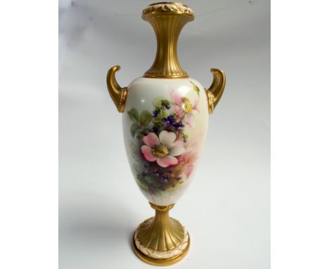Royal Worcester twin handled urn hand painted with dog roses and violets signed Cole. Numbered to base 2049. Height 24cm     