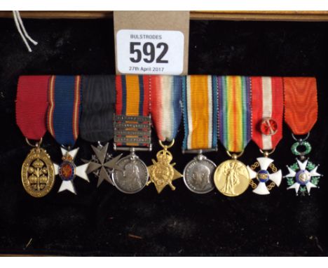 A miniature group of 9 medals comprising The order of the Bath sash badge in 18ct gold, the Royal Victorian Order, a 4 bar Qu
