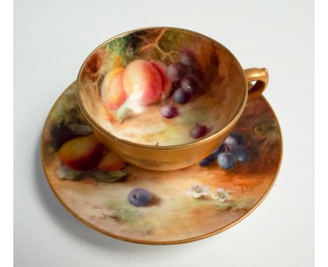 Royal Worcester cabinet cup and saucer, hand painted with fruit and flowers signed Roberts     Condition - chip to the rim of