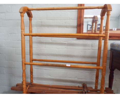 A light wood towel rail and a easel