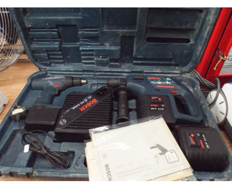 A Bosch cordless drill with charger and a Bosch 24 volt hammer drill with charger and spare battery 