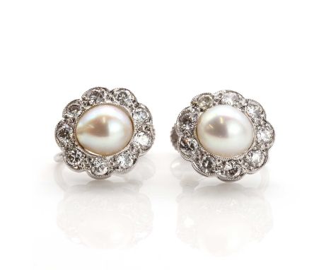 A pair of cultured pearl and diamond cluster earrings,with a fully drilled cultured pearl set to the centre. A border of bril