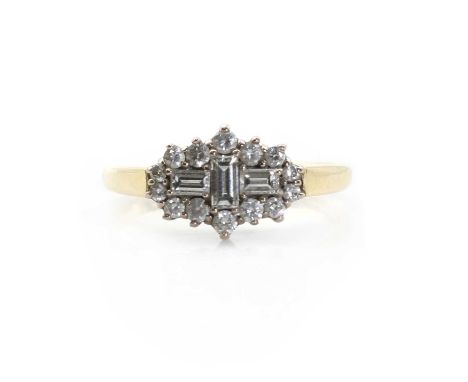 An 18ct gold diamond cluster ring, with three step cut diamonds, to a surround of brilliant cut diamonds, all claw set to a r