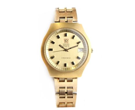 A gentlemen's Omega Electronic F.300Hz quartz bracelet watch,A tonneau shaped case, 40mm x 43mm, with a circular gilt dial, w