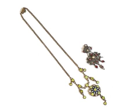 An early 20th century Continental silver gilt gemstone and enamel necklace, a series of circular cut olive green garnet and g