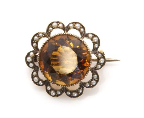 A citrine and split pearl brooch, by Murrle Bennett &amp; Co., c.1900, with a circular mixed cut citrine, milligrain set to a