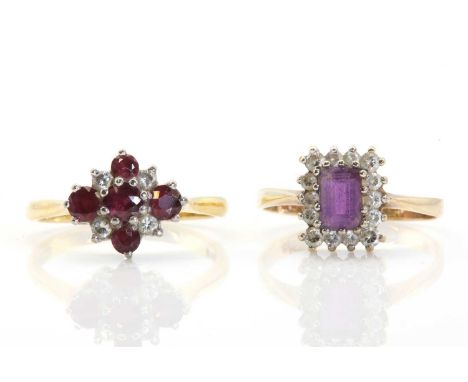 An 18ct gold ruby and diamond cluster ring, a cluster of alternating round mixed cut rubies and round brilliant diamonds, cla