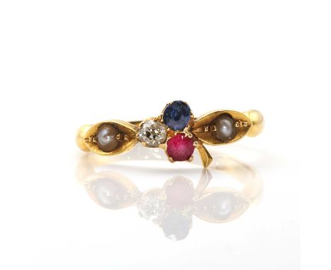 A late Victorian ruby sapphire and diamond trefoil ring, the three stones all near round cut and claw set with a stalk, and l