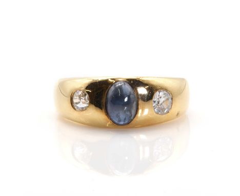 An Edwardian sapphire and diamond Prussian style ring,  with an oval cabochon sapphire gypsy set to the centre. An old Europe