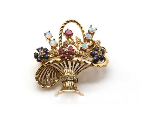 A 9ct gold diamond and gem set giardinetti brooch,with a pierced basket, with a twisted wire handle. Flower head with brillia