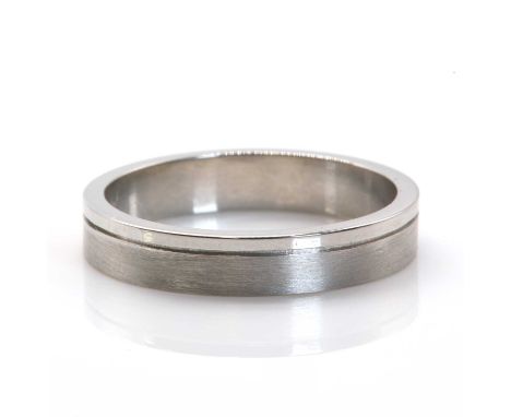 A platinum flat section band ring,4.00mm wide, with a satin finish ground and polished striped to one side, Birmingham 2006. 