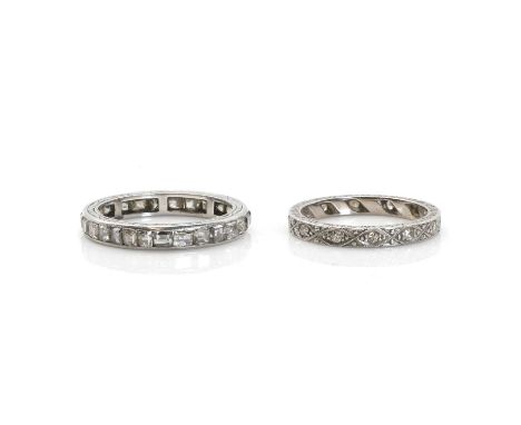 Two platinum and diamond eternity rings,to include a platinum full eternity ring, with a row of step cut diamonds channel set