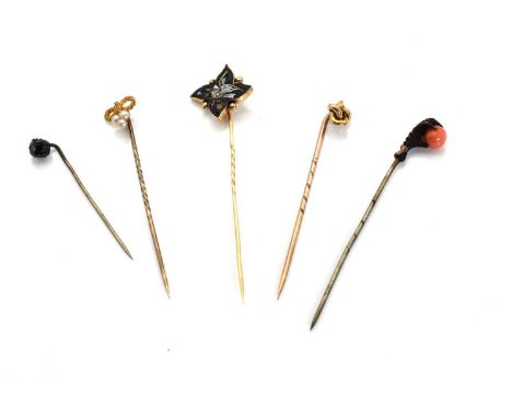 Three gold stick pins,comprising a gold micro mosaic stick pin, a quatrefoil micromosaic depicting a dove with gold beads to 