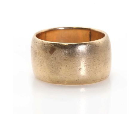 A gold wedding ring,a plain wide gold D section band, 11.55mm wide, tested as approximately 9ct gold, 10.36g.Finger size Q LE