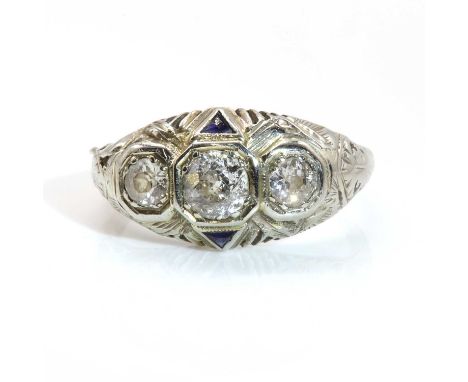 An American Art Deco three stone diamond and synthetic sapphire ring, with three graduated old European cut and old Swiss cut