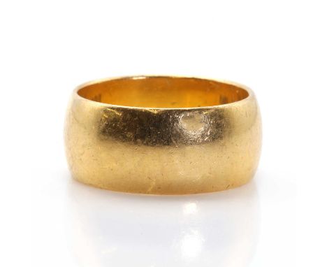 A 22ct gold wedding ring,a plain broad band, 8.70mm wide, London 1964, 10.57g.Finger size NCondition ReportScuffs and scratch