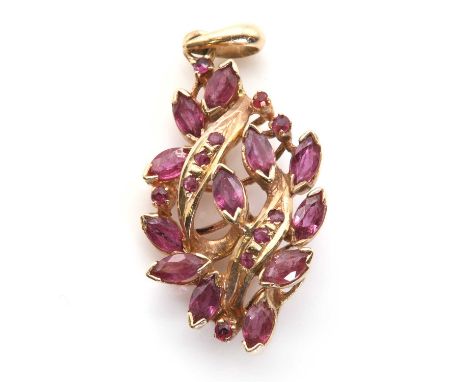 A ruby and gold pendant, of navette outline and pierced asymmetric design, set with twelve marquise cut rubies and further sm