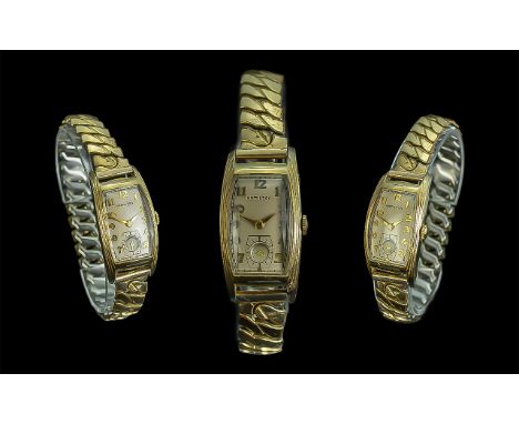 Hamilton 1930's Tonneau Shaped Gent's Watch on expandable gold plated strap; a fine example of this classic American design o