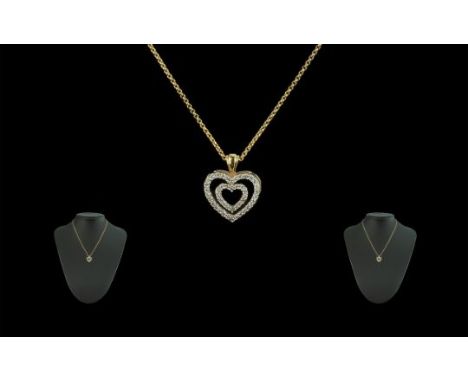 18ct Gold Double Heart Shaped Diamond Set Pendant - Attached to a 18ct Gold Chain. Both Pieces Marked 18ct. The Round Faceted