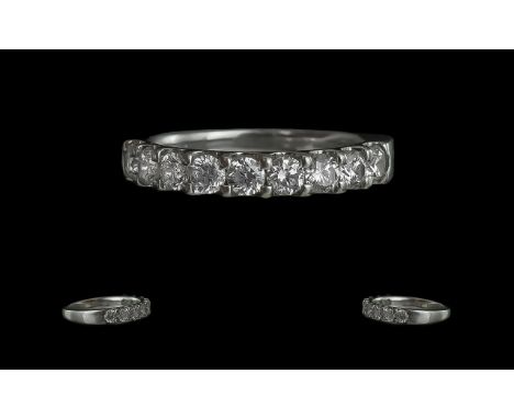 A Superb Platinum Diamond Set Band Ring, In a Prong Setting. Ring Size K. Marked Platinum 950 to Interior of Shank. The Round
