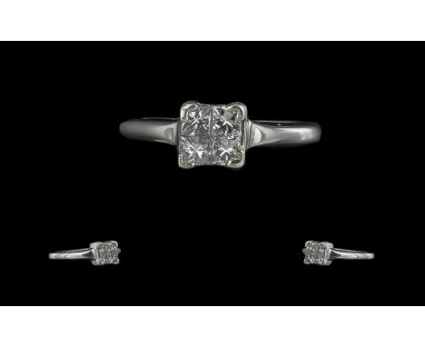 18ct White Gold - Contemporary 4 Stone Diamond Set Ring. Full Hallmark to Interior of Shank. The 4 Square Princes Cut Diamond