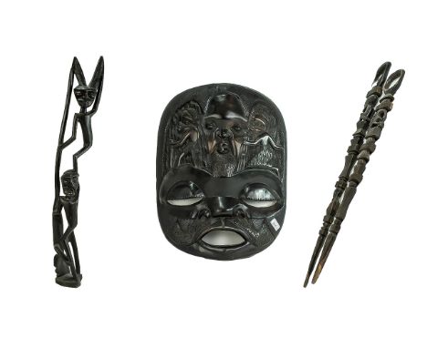 Tribal Art Interest. A Collection of Four Carved Wooden Items. To include a large face mask 22 by 18 inches, stylised figural