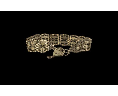 9ct Gold Gate Bracelet, with a heart shaped locket and safety chain.  Fully hallmarked, weight approx. 7 grams.  In original 