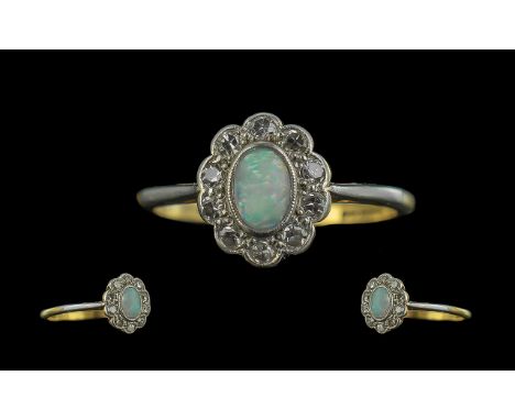 Antique Period 18ct White Gold and Platinum Opal and Diamond Set Ring. Marked Platinum - 18ct. The Oval Shaped Opal Surrounde