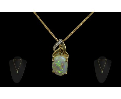 A Superb 18ct Gold Diamond and Opal Set Pendant, The Large Oval Shaped Opal of Excellent Multi-Colours. Est Weight 8.00 cts, 