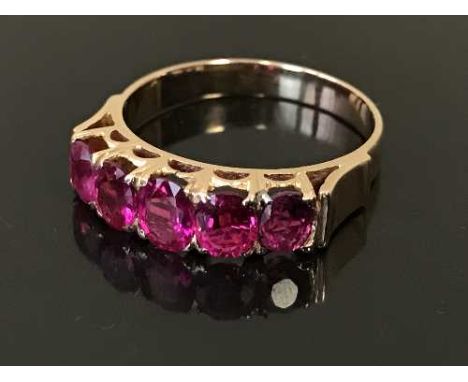 A ruby half-eternity ring, the five rubies estimated to weigh a total of 1.75 carat, 3.5g