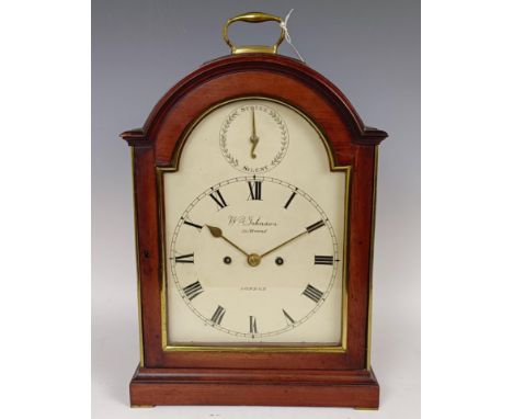 A bracket clock, the 20 cm arched square painted dial, signed W Johnson, 50 Strand, London, with Roman numerals and subsidiar