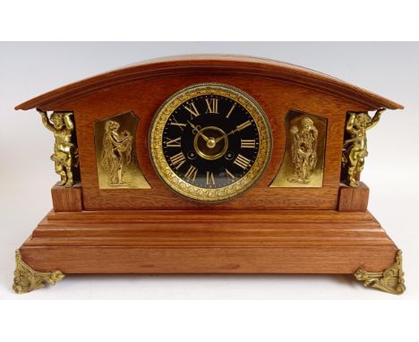 An Edwardian mantel clock, in a gilt metal and walnut case, 25 cm high, and two other clocks (3)  Provenance: Sold on behalf 