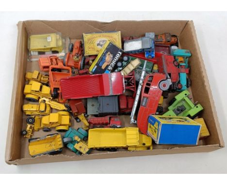 A Dinky Toys fire engine, and assorted other play worn cars and trucks