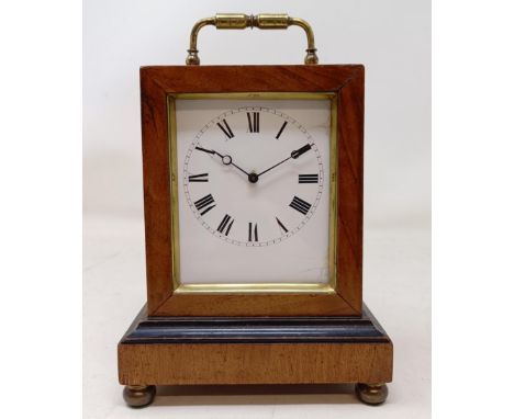 A mantel clock, in a gilt spelter figural case, on a carved wood and gesso base, 42 cm high, and a mantel clock, in a walnut 