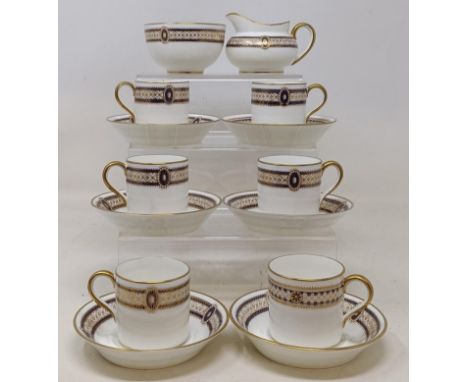 A set of six Cauldon coffee cups and saucers, a matching milk jug and sugar bowl, a Delft two handled bowl, a similar mug, as