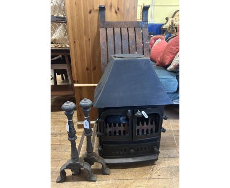 A wood burning stove, a pair of fire dogs and a fire grate (4)no glass
