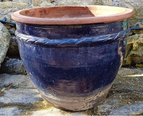 A blue glazed garden planter, and two wheelbarrows (3)