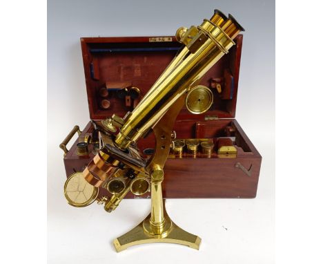 A late 19th century R &amp; J Beck London &amp; Philadelphia brass binocular microscope, with various objectives and accessor