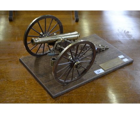 Military history - a scale model of a canon, wooden plinth , American gun carriage.