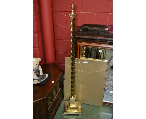 A brass barley twist standard lamp, stepped square socle and base.