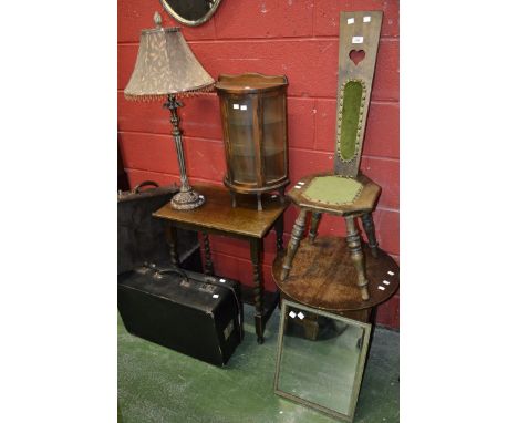 An oak table, c.1930's; an oak stool, c.1940's; an oak hall chair; two suitcases; an ornate table lamp; a wall hanging mirror