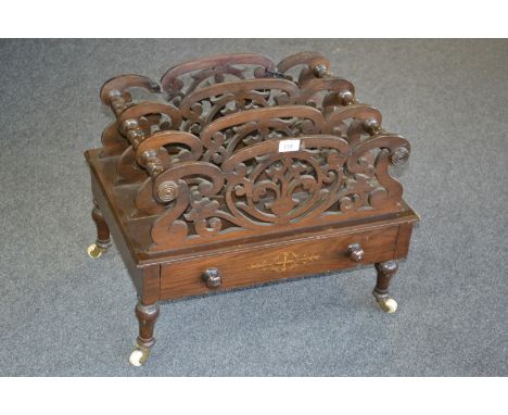 A Victorian mahogany four division canterbury, fretworked dividers, turned spacers and legs, satinwood inlaid drawer to base 